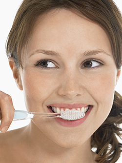 woman brushing her teeth