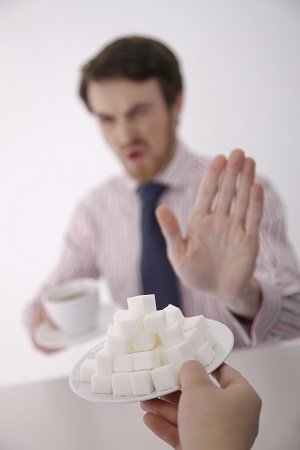 man saying no to sugar