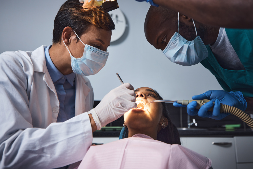 Dentist doing tooth extraction